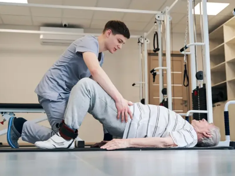 Patient working through guided mobility exercises with a therapist