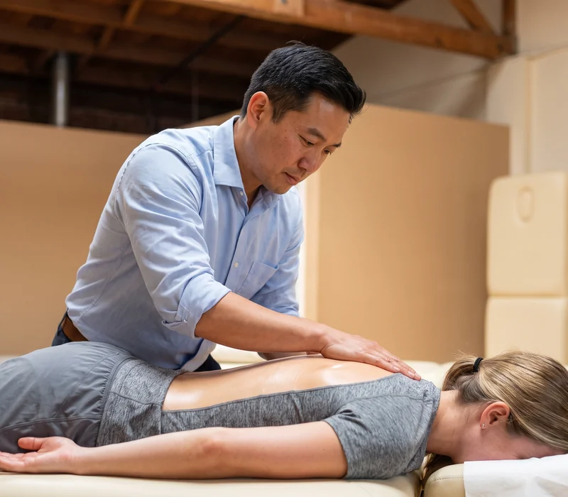 Therapist providing recovery-focused soft tissue massage