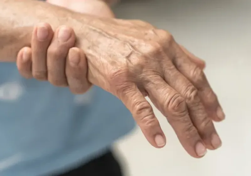 Therapist assessing joint mechanics during an orthopedic evaluation